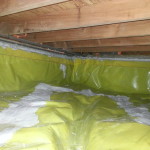 Crawlspace vapor barrier sealed up foundtaion walls and at vents