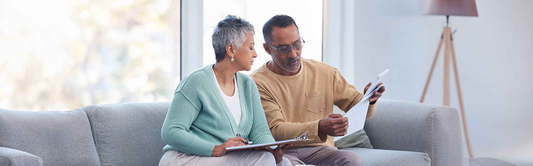 A couple reviewing home efficiency plans