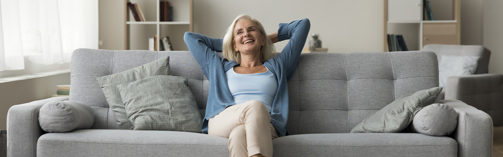 Woman relaxing on her living room couch