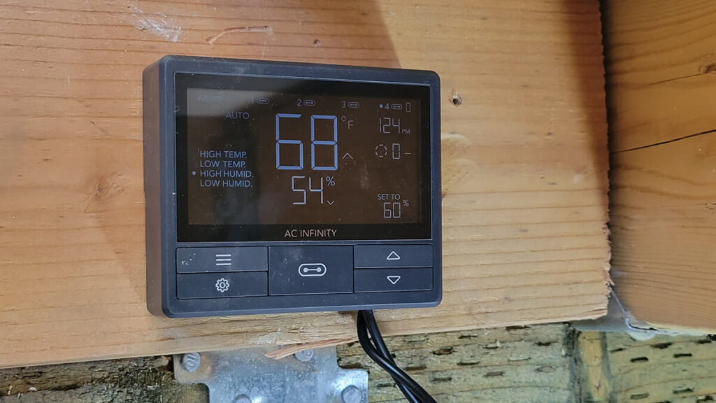 AirTital Display in the hatch of a crawlspace